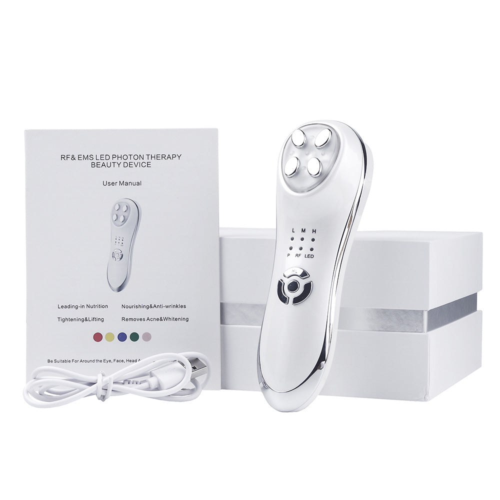 RF & EMS LED Photon Therapy beauty device with user manual and cable on a white background
