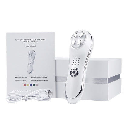 RF & EMS LED Photon Therapy beauty device with user manual and cable on a white background